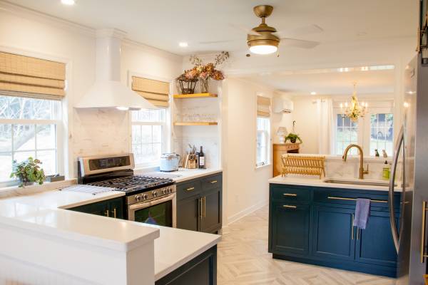 Pictured: Kelly Cottage kitchen, navy cabinets with stove and sink