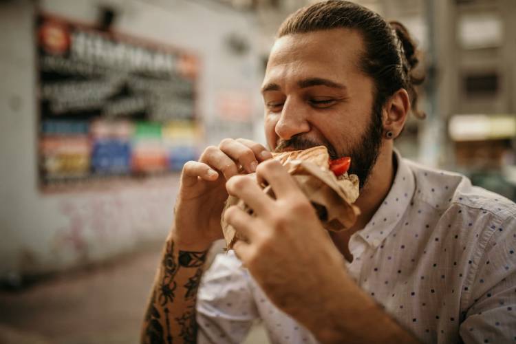 person eating a sandwhich