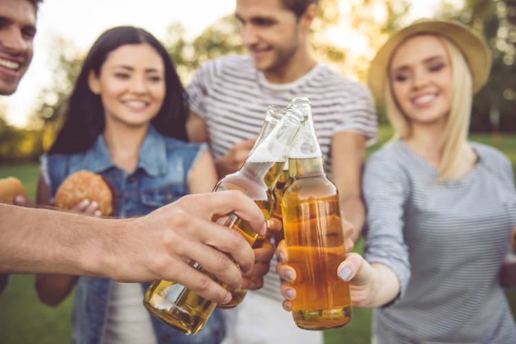 A group of friends enjoys ciders