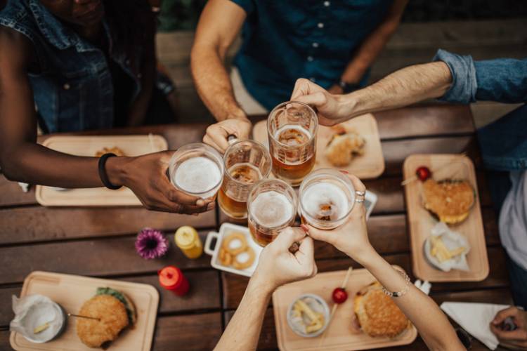 Friends enjoy beers at a local brewery