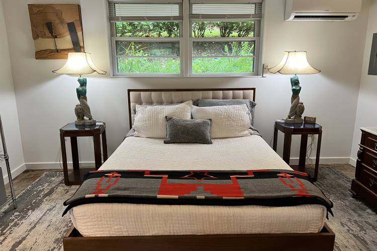 McHill Studio Pictured: bed and nightstands at McHill Studio Apartment