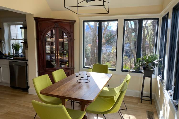 Pictured: Monticello Vista dining table with 6 green chairs
