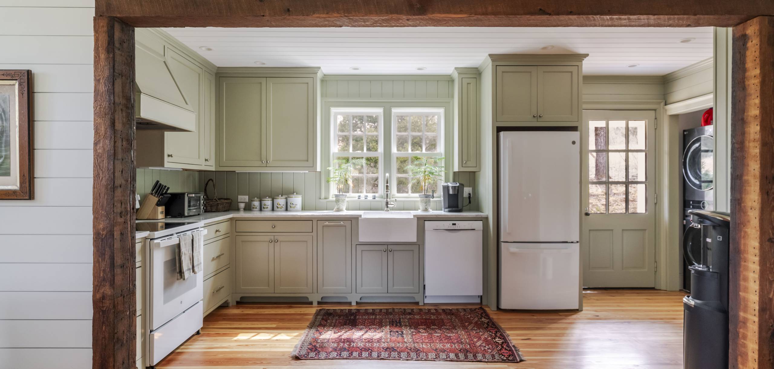 Stockton Creek Farmhouse farmhouse kitchen with reclaimed wood door casing