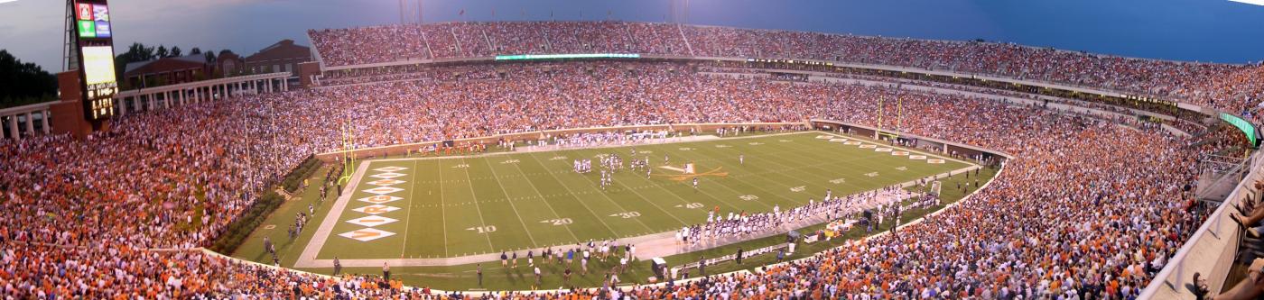 A night shot of a packed UVA home football game at Scott Stadium